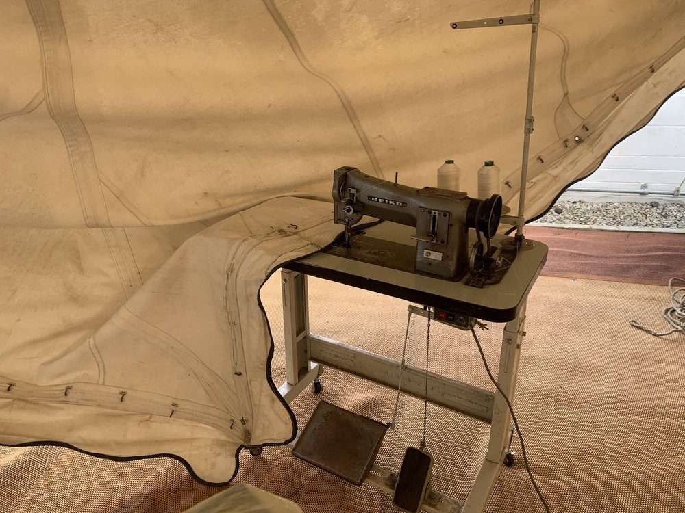 Industrial sewing machine set up for a marquee repair