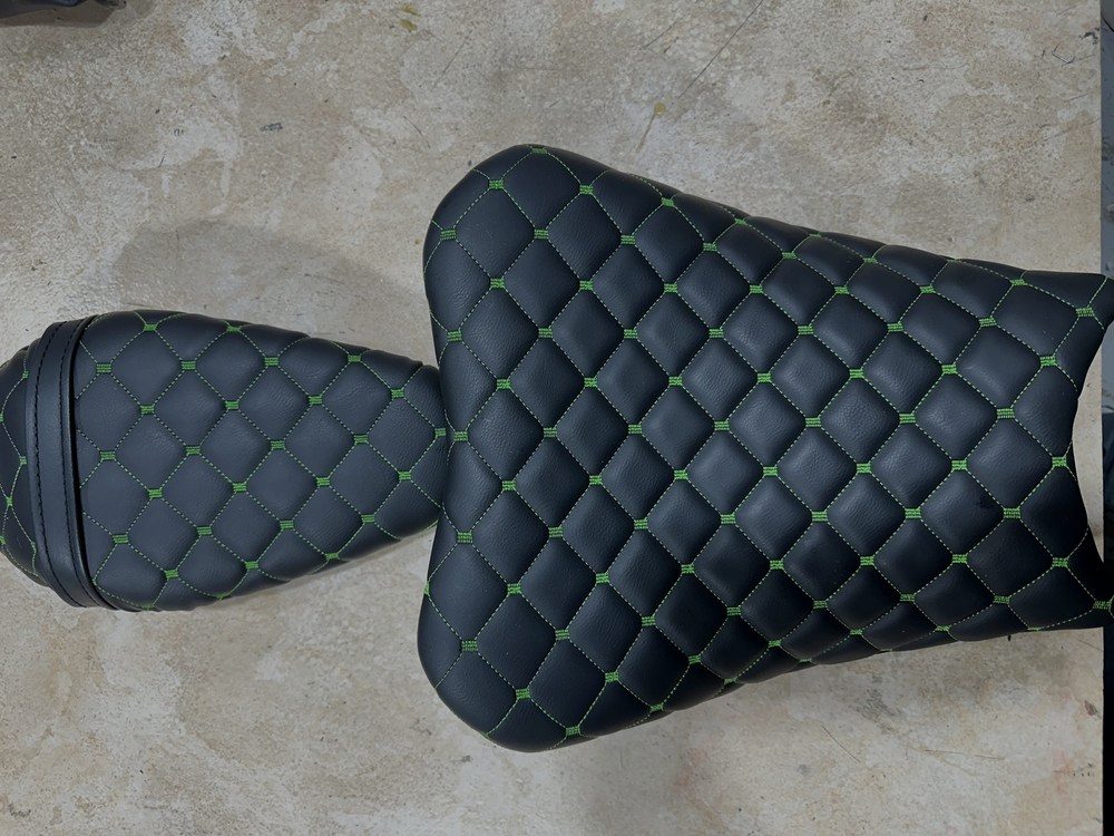 Quilted leather stitching on a motorcycle seat